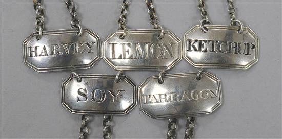 Five George III and later silver sauce labels;